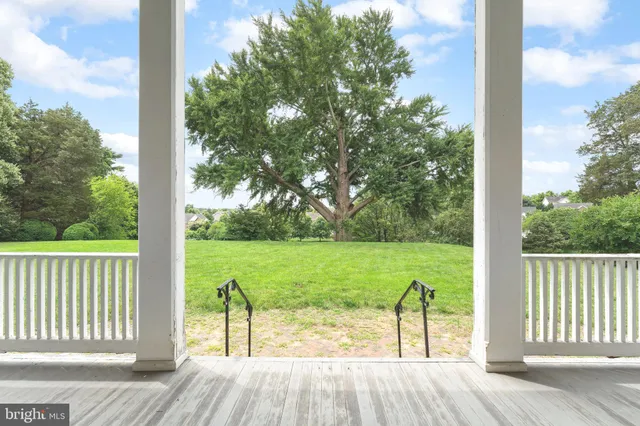 a view of a deck with a yard