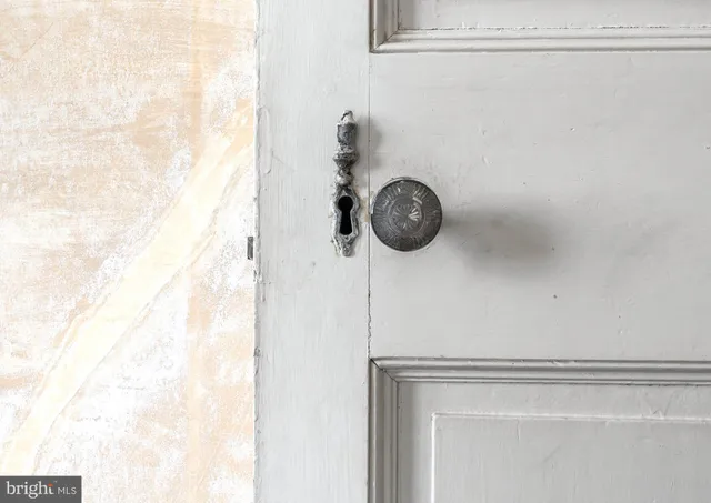 a open kitchen with a table and a fireplace