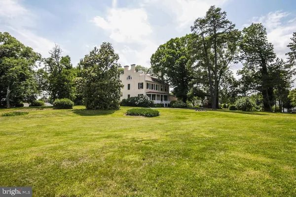 a view of swimming pool with outdoor seating and yard