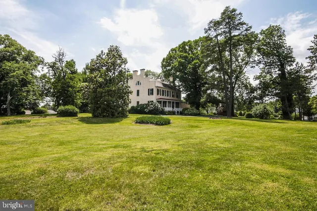 a view of swimming pool with outdoor seating and yard