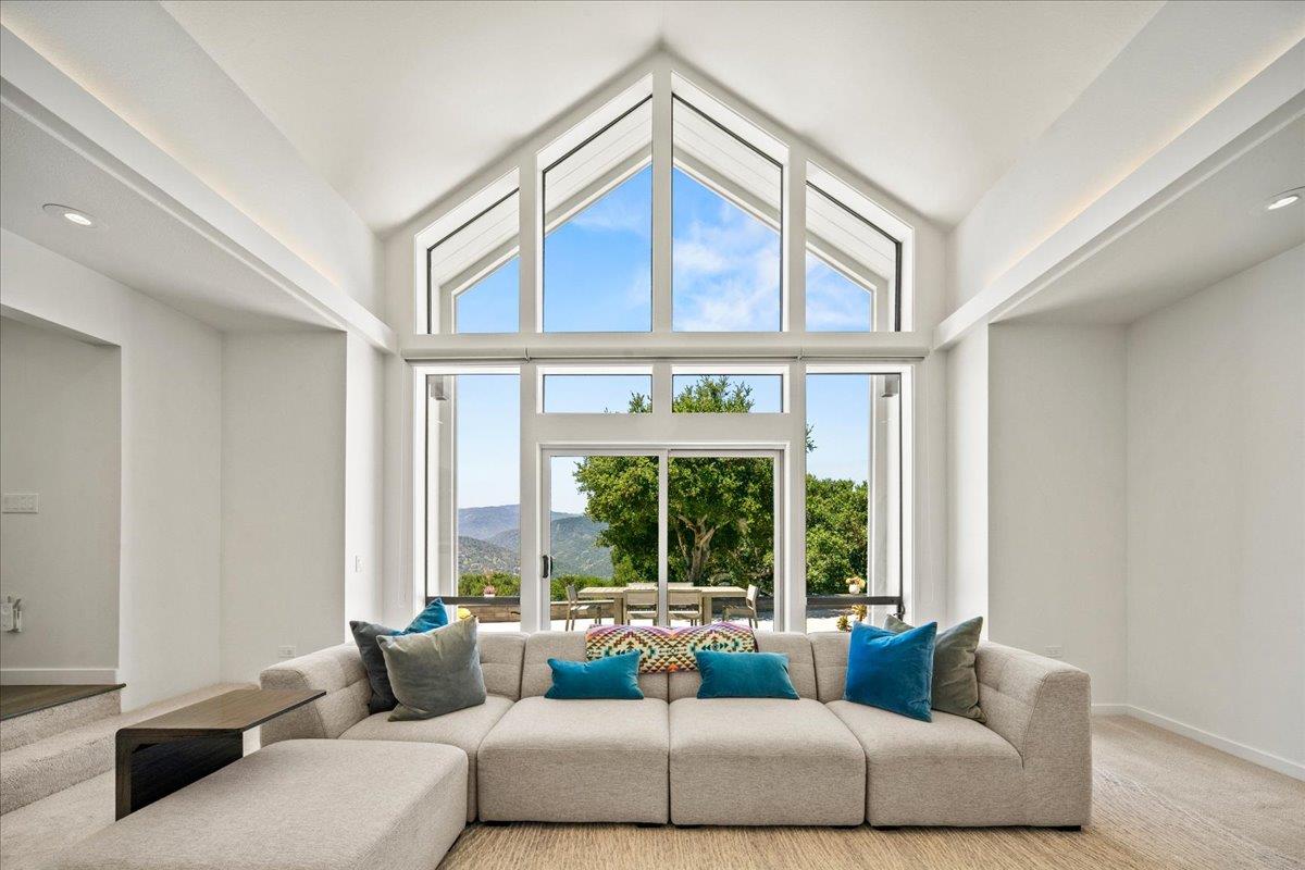31499 Vía Las Rosas Carmel Valley, CA 93924 - Photo 12 of 44 a living room with furniture and a large window