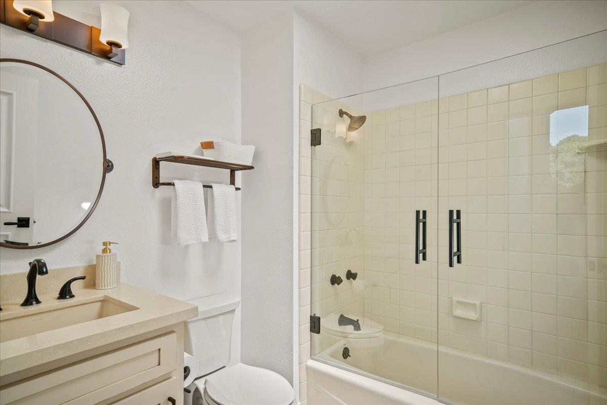 31499 Vía Las Rosas Carmel Valley, CA 93924 - Photo 26 of 44 a bathroom with a sink a toilet and a mirror