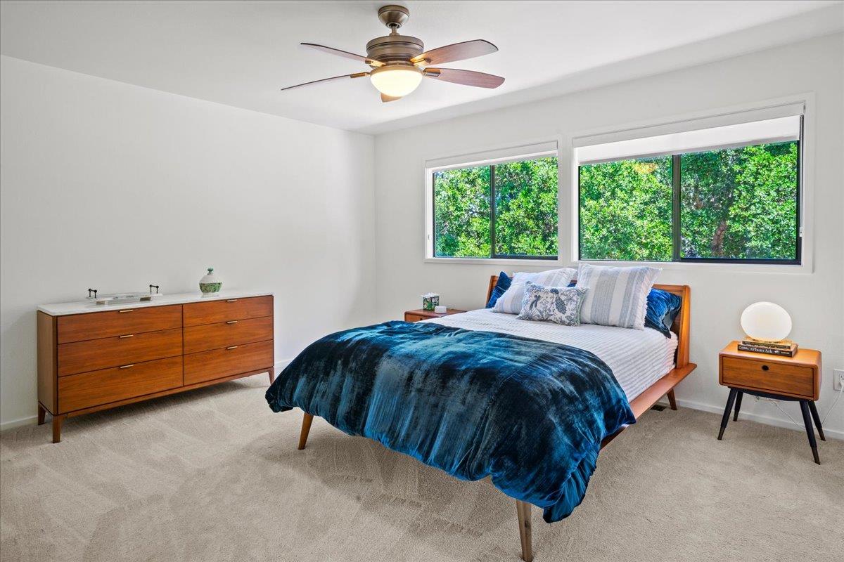 31499 Vía Las Rosas Carmel Valley, CA 93924 - Photo 27 of 44 a bedroom with a bed and a dresser