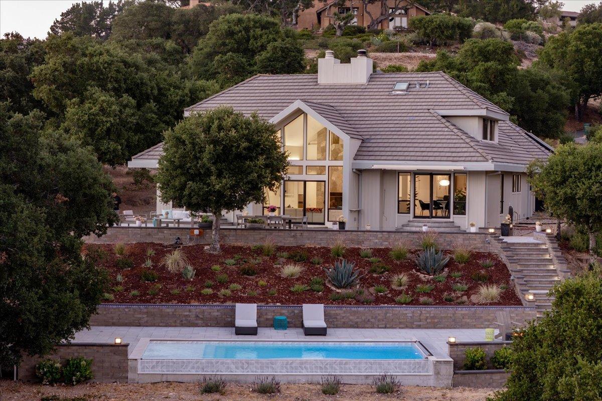 31499 Vía Las Rosas Carmel Valley, CA 93924 - Photo 40 of 44 a front view of a house with a yard