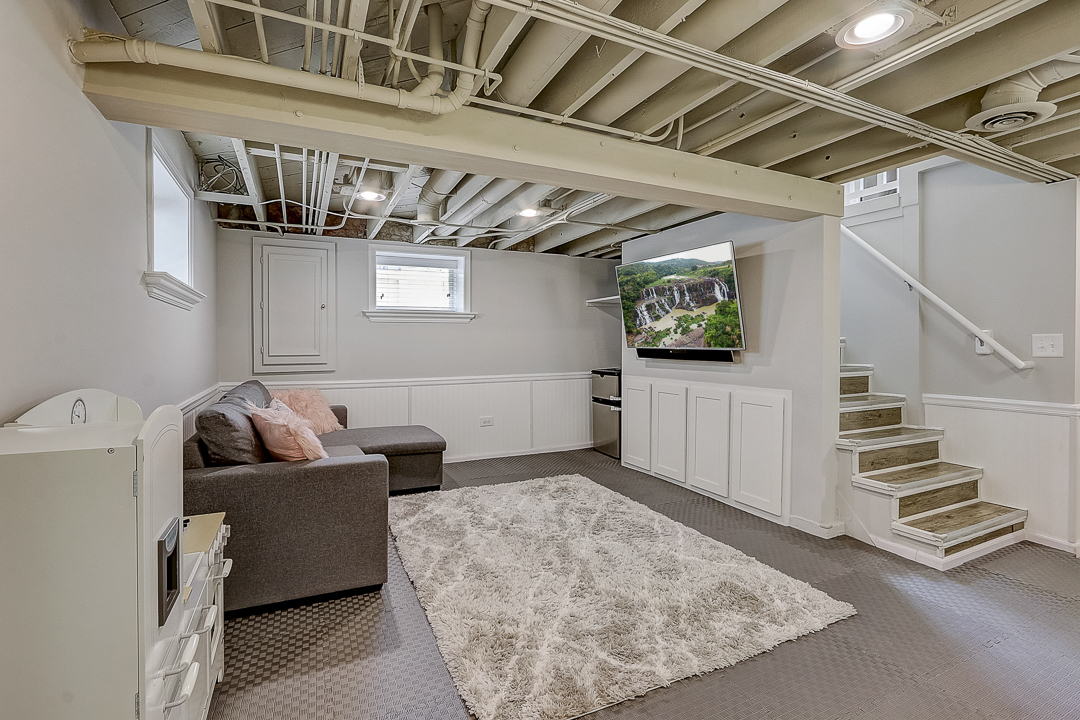 1025 North Main Street Naperville, IL 60563 - Photo 15 of 28 a living room with furniture and stairs