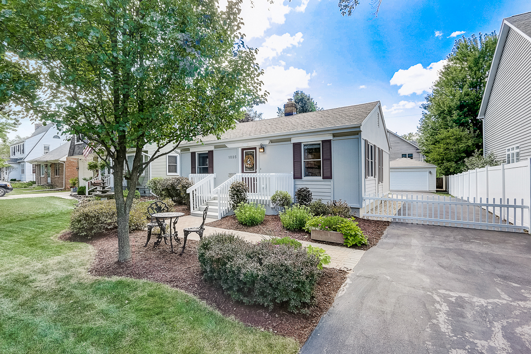 1025 North Main Street Naperville, IL 60563 - Photo 26 of 28 a front view of house with a garden and patio