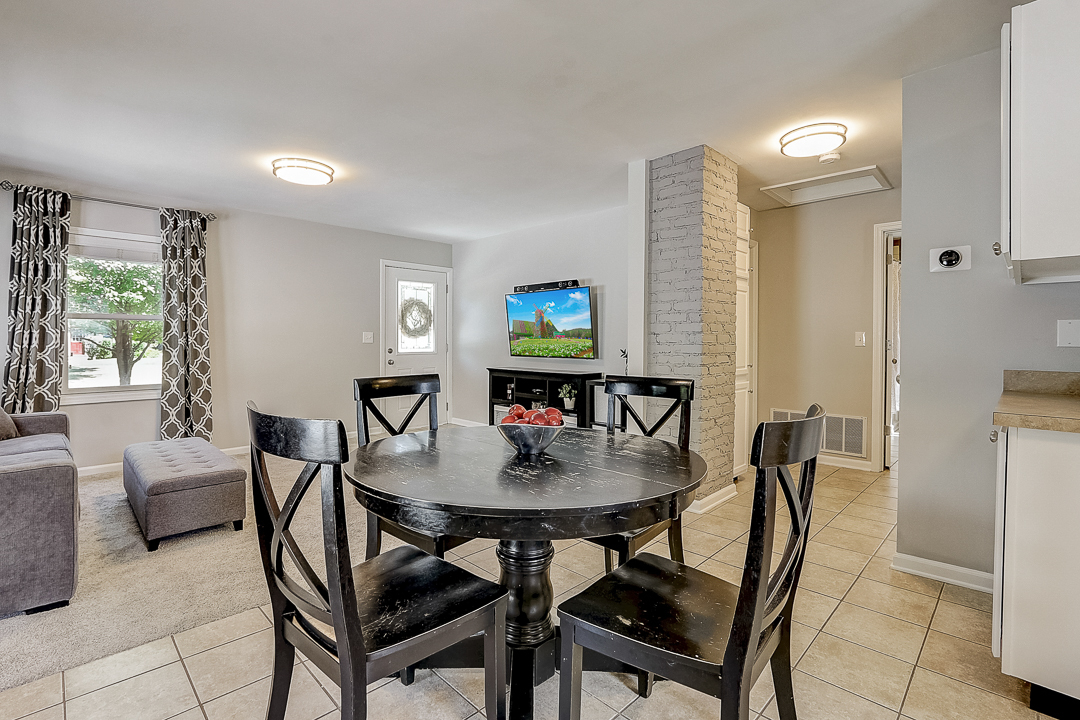 1025 North Main Street Naperville, IL 60563 - Photo 6 of 28 a view of a dining room with furniture and window