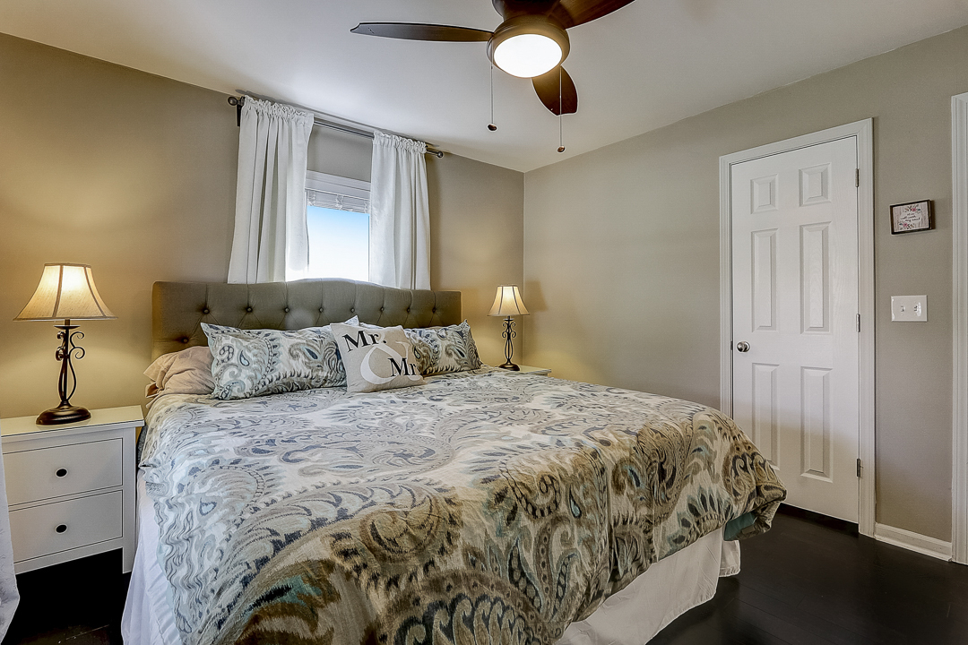 1025 North Main Street Naperville, IL 60563 - Photo 10 of 28 a bedroom with a bed and a lamp