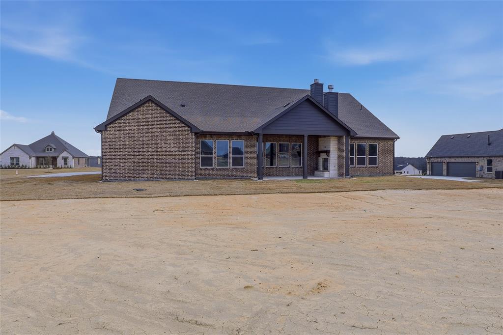 812 Vly Rdg Road Van Alstyne, TX 75495 - Photo 31 of 33 a front view of a house with a yard