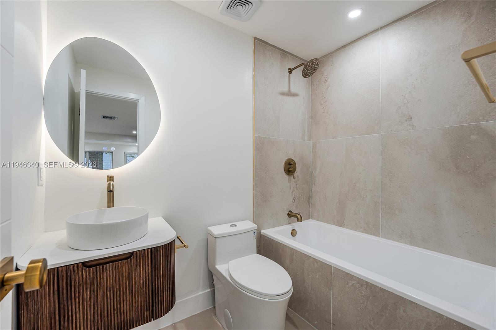 1065 Northwest 50th Street Miami, FL 33127 - Photo 15 of 21 a bathroom with a sink a toilet and shower