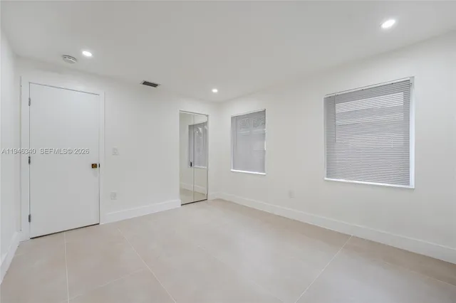 a view of a park with large trees