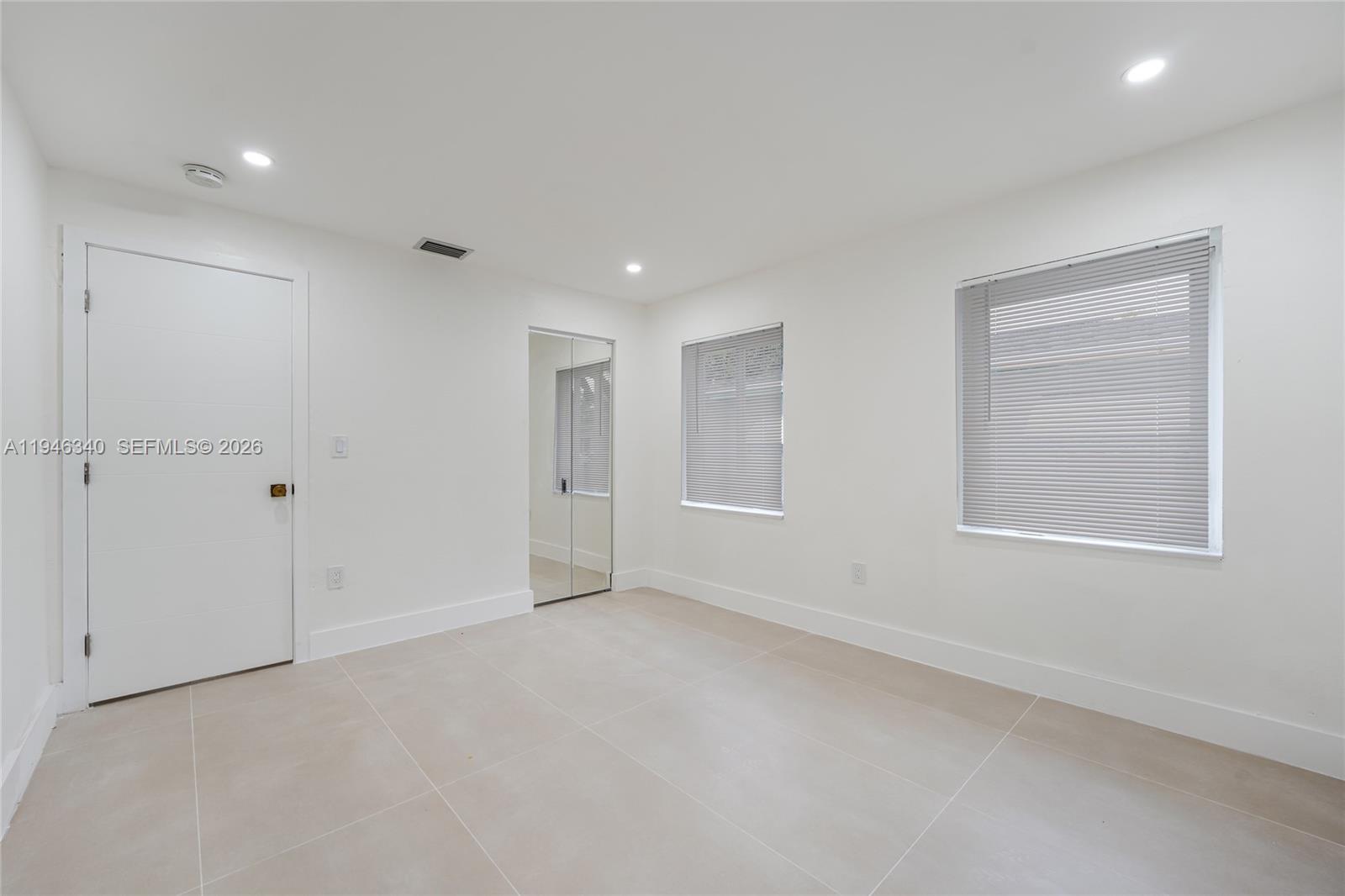 1065 Northwest 50th Street Miami, FL 33127 - Photo 17 of 21 a view of an empty room with a window