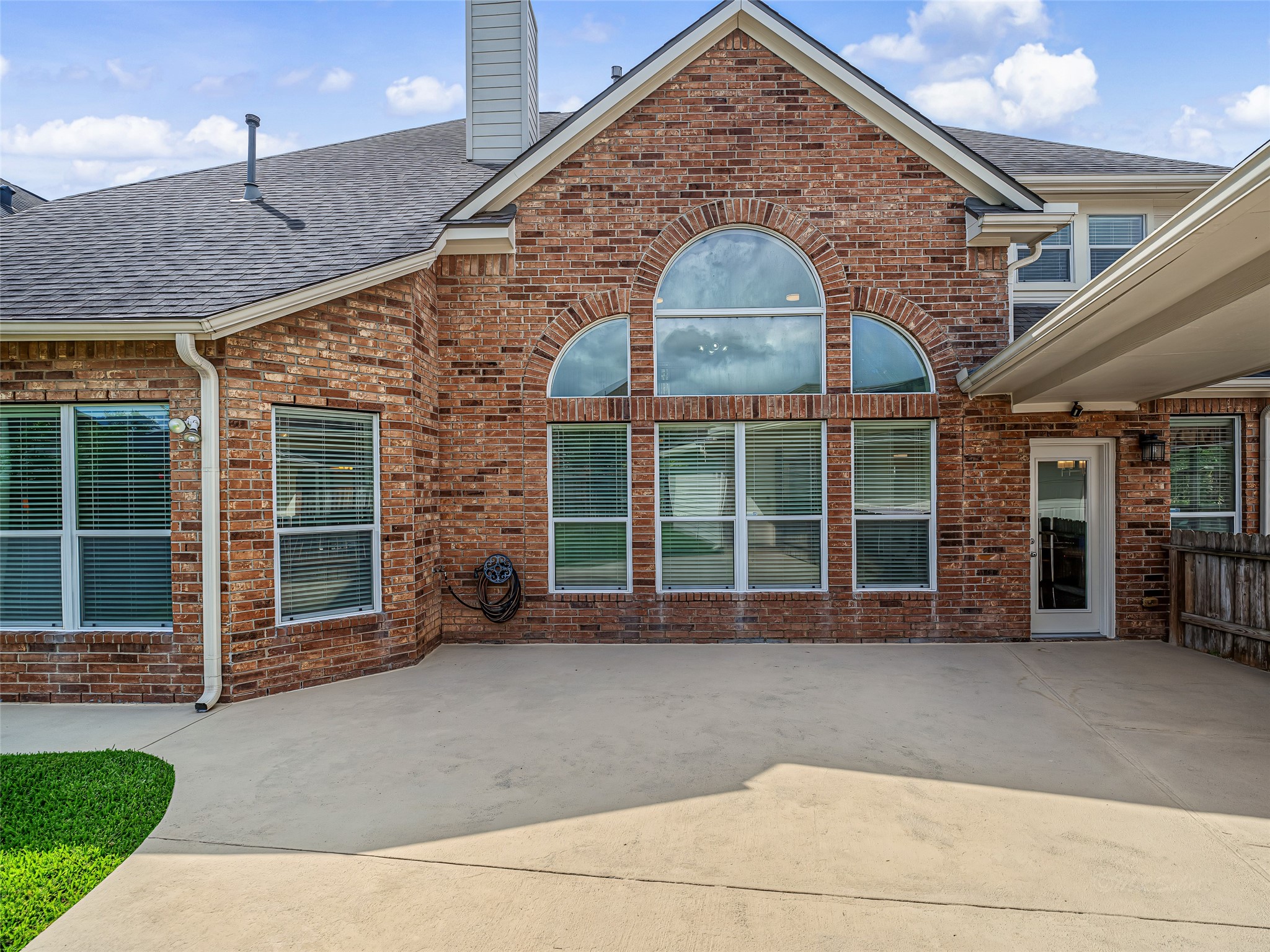 2210 Fox Path Katy, TX 77494 - Photo 42 of 47 A spacious concrete patio sweeps across the back of the home, offering an ideal, low-maintenance foundation for outdoor dining sets, lounge chairs, a barbecue grill station, or a fire pit.