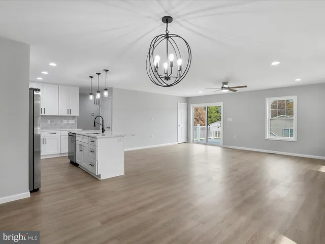 a view of kitchen with cabinets and wooden floor