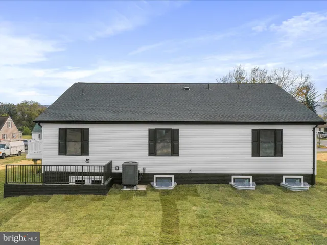 a view of a house with swimming pool and porch