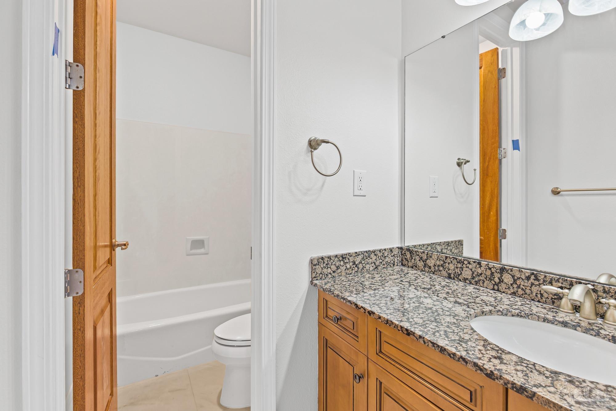 14900 River Road, Unit 904 Perdido Key, FL 32507 - Photo 34 of 62 a bathroom with a granite countertop sink toilet and shower