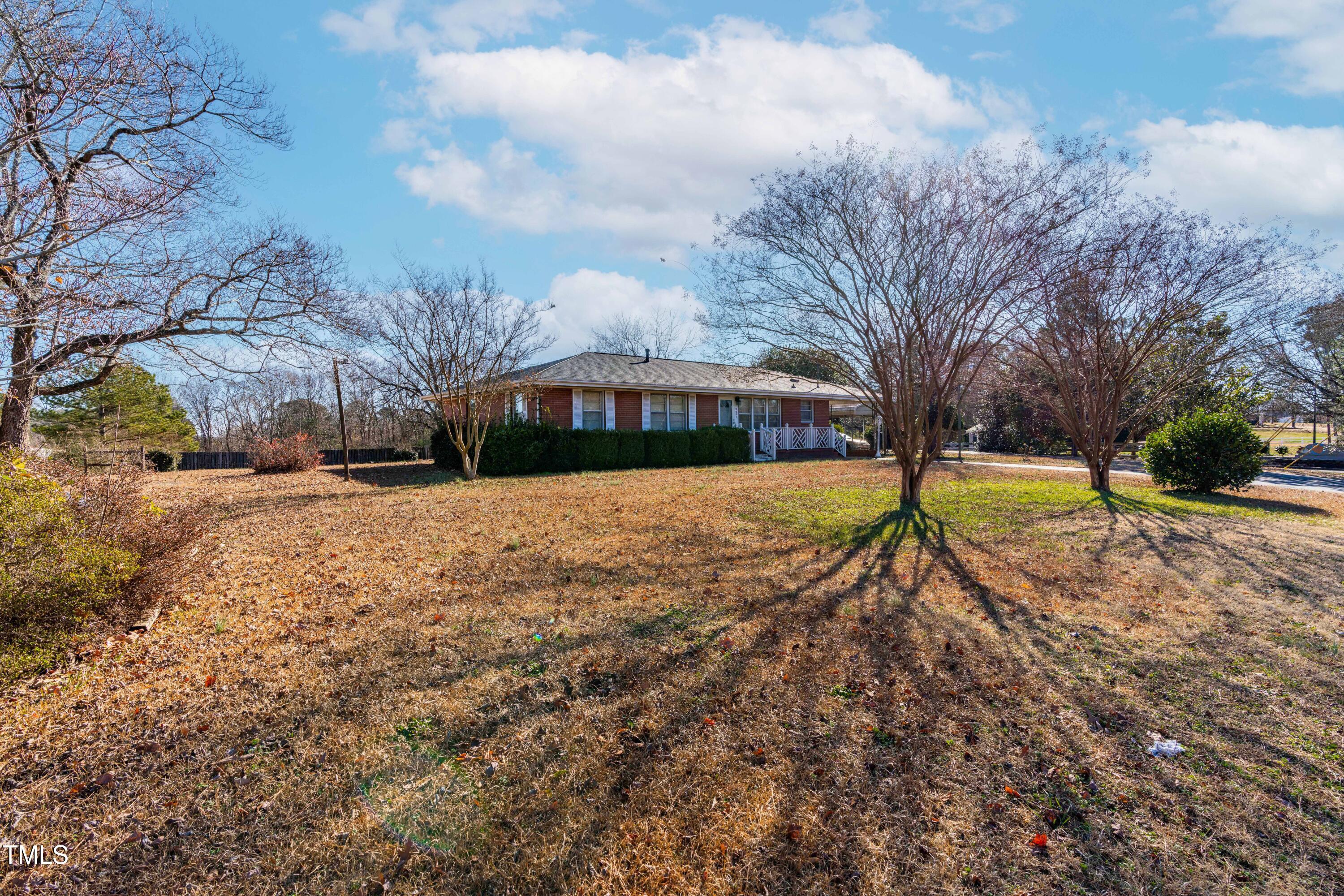3001 Benson Road Garner, NC 27529 - Photo 3 of 13 a view of swimming pool with tree s