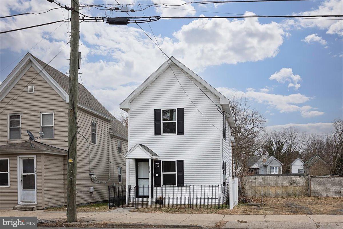 728 Race Street Cambridge, MD 21613 - Photo 1 of 14 a view of a house with a street