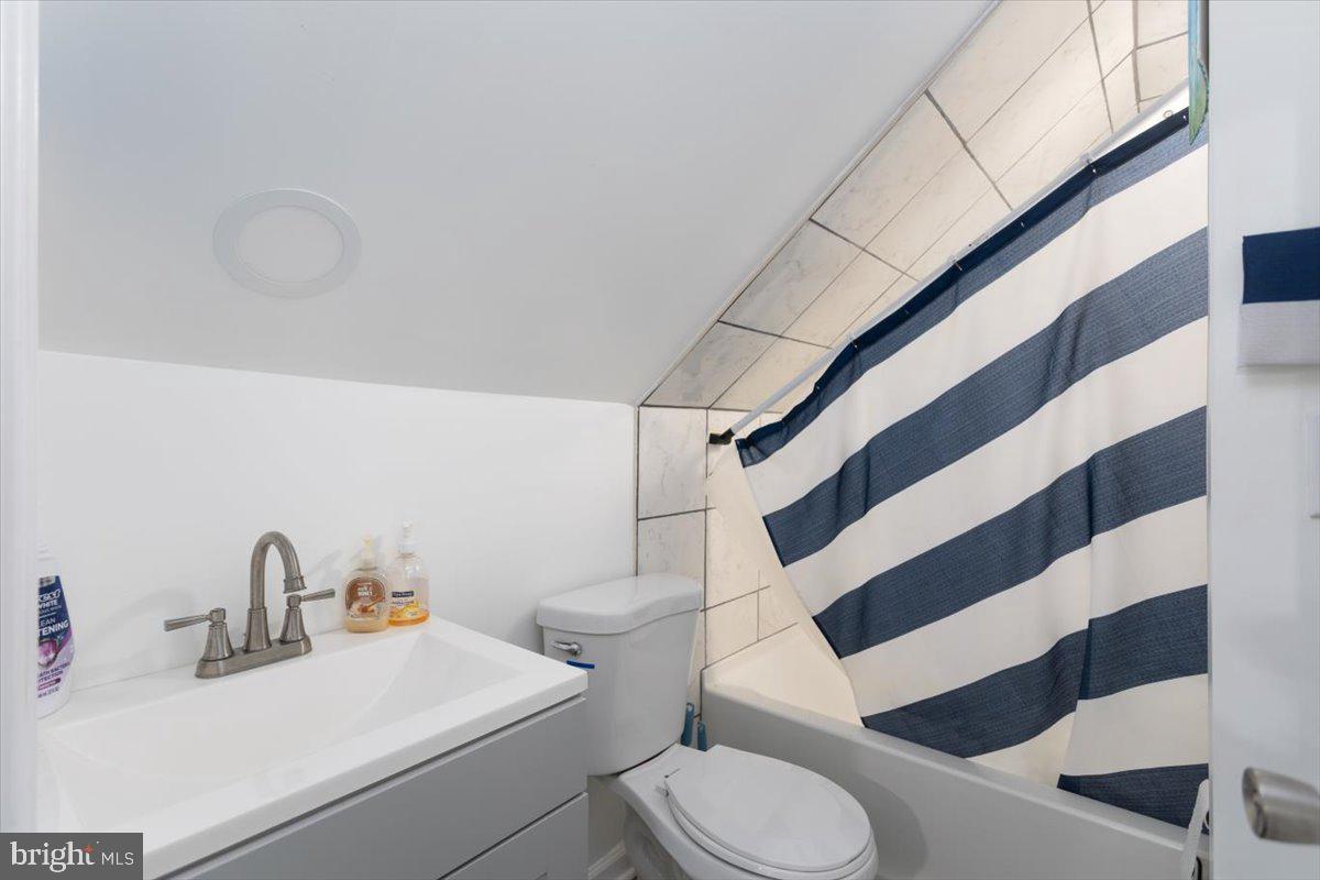 728 Race Street Cambridge, MD 21613 - Photo 11 of 14 a bathroom with a sink and a toilet