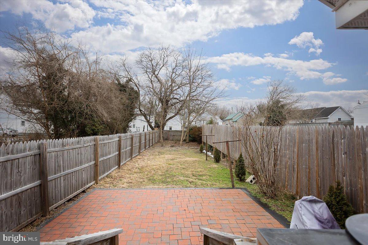 728 Race Street Cambridge, MD 21613 - Photo 13 of 14 a view of a backyard with wooden fence