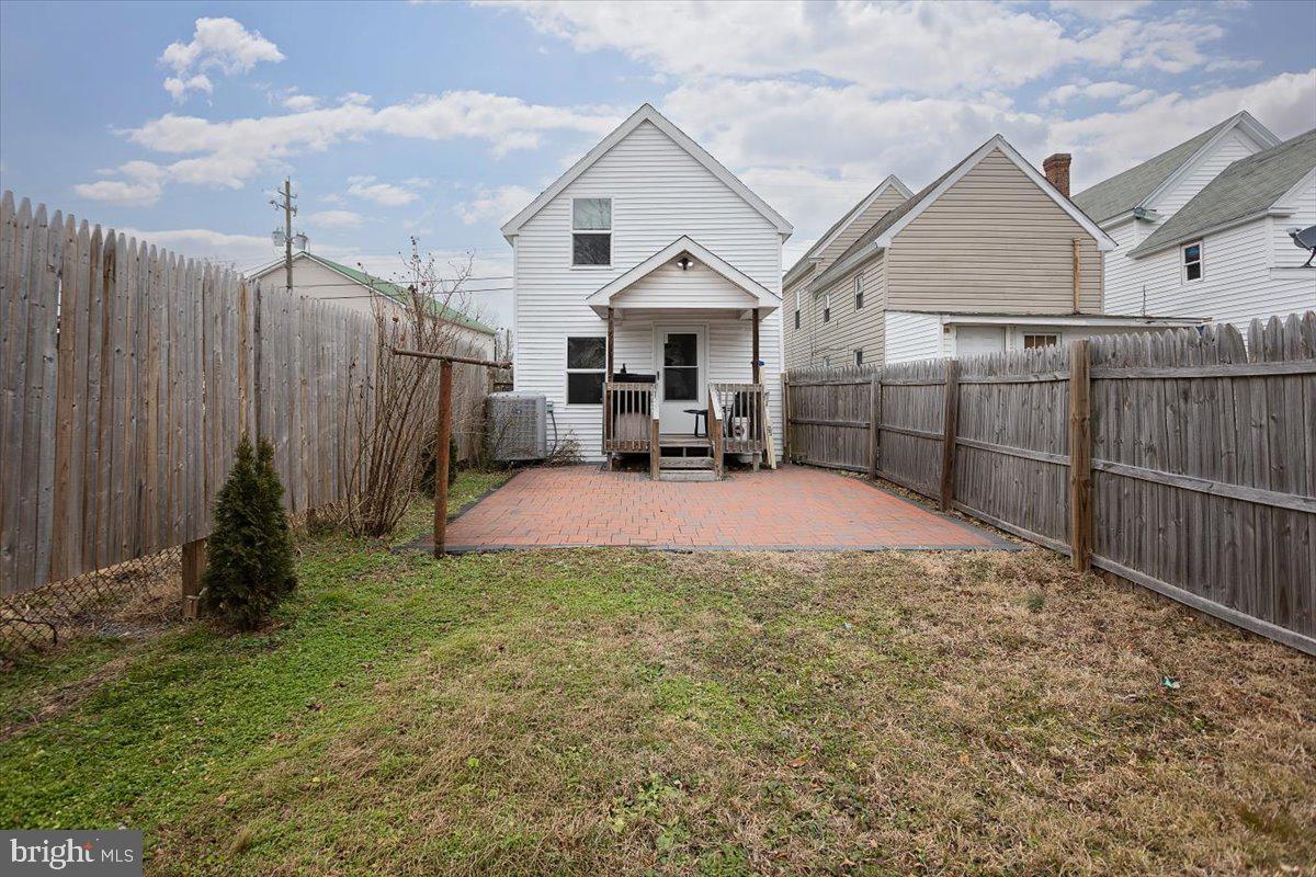 728 Race Street Cambridge, MD 21613 - Photo 14 of 14 a view of a house with backyard and wooden fence