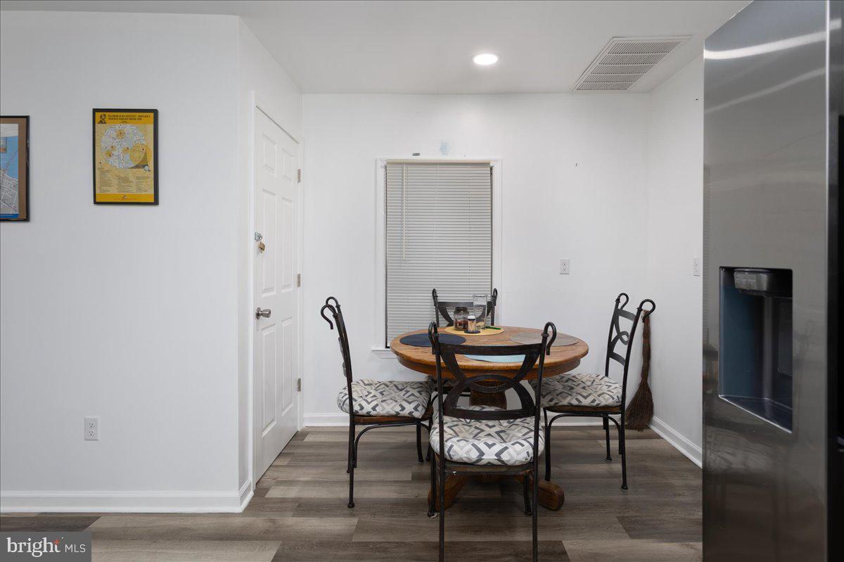 728 Race Street Cambridge, MD 21613 - Photo 6 of 14 a view of a dining room with furniture and window