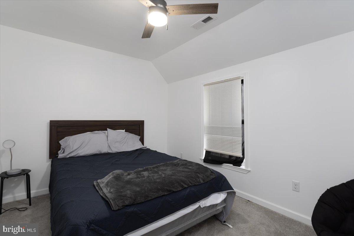 728 Race Street Cambridge, MD 21613 - Photo 10 of 14 a bedroom with a bed and window