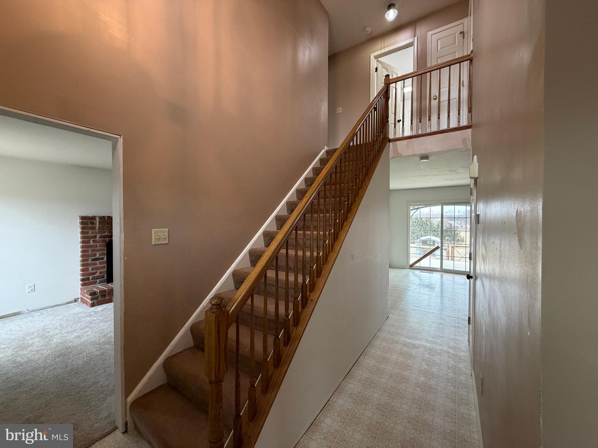 4 Subdivision Road Newville, PA 17241 - Photo 53 of 78 a view of staircase with lots of frames on wall and a window