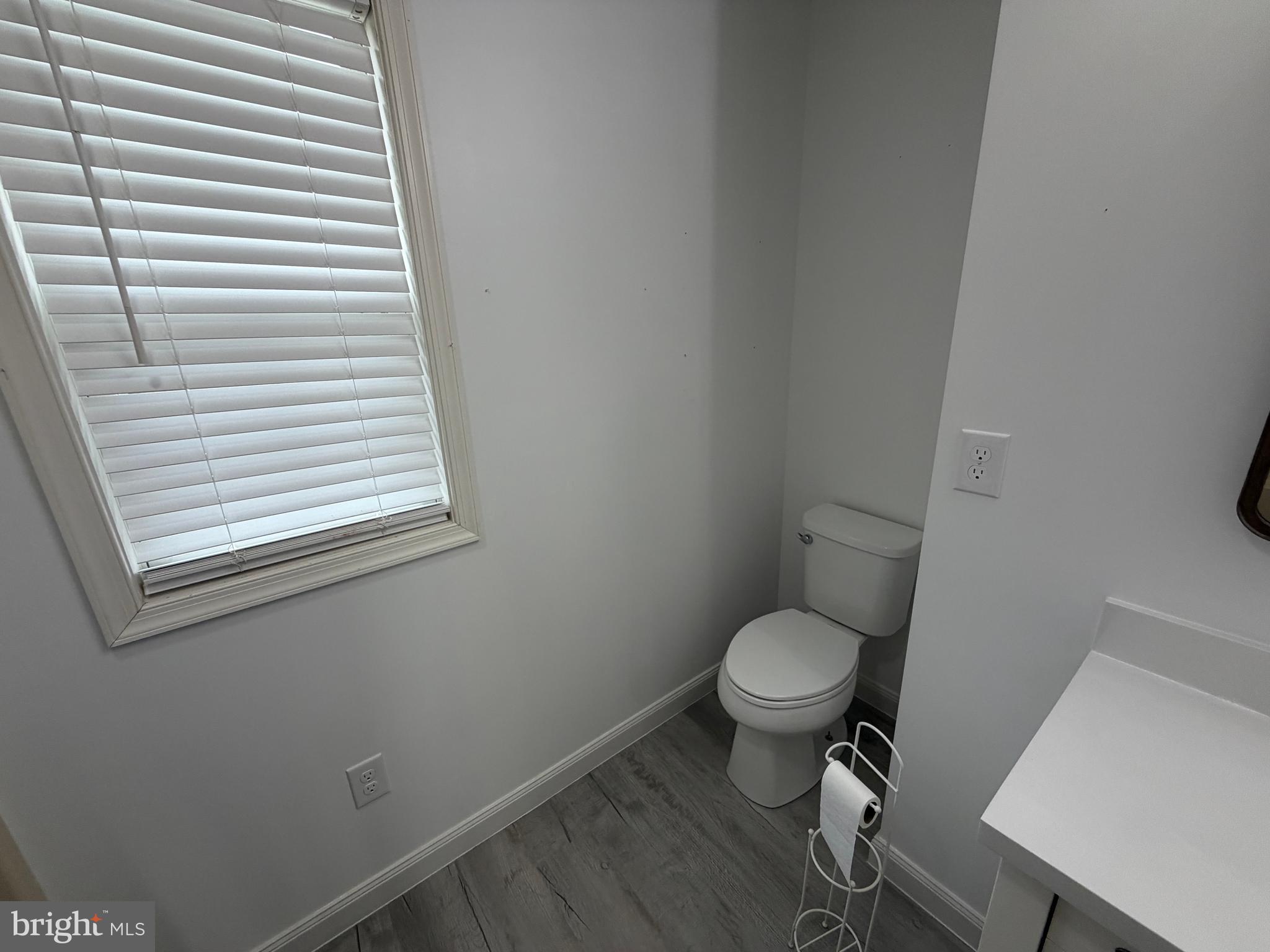 4 Subdivision Road Newville, PA 17241 - Photo 66 of 78 a white toilet sitting in a bathroom next to a window