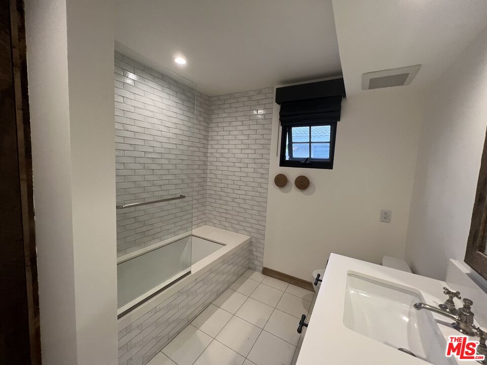 3360 Wrightview Place Studio City, CA 91604 - Photo 12 of 16 a bathroom with a toilet and a shower