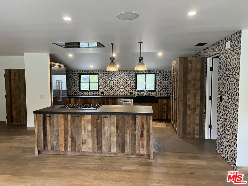 3360 Wrightview Place Studio City, CA 91604 - Photo 6 of 16 a view of a kitchen with a sink and refrigerator