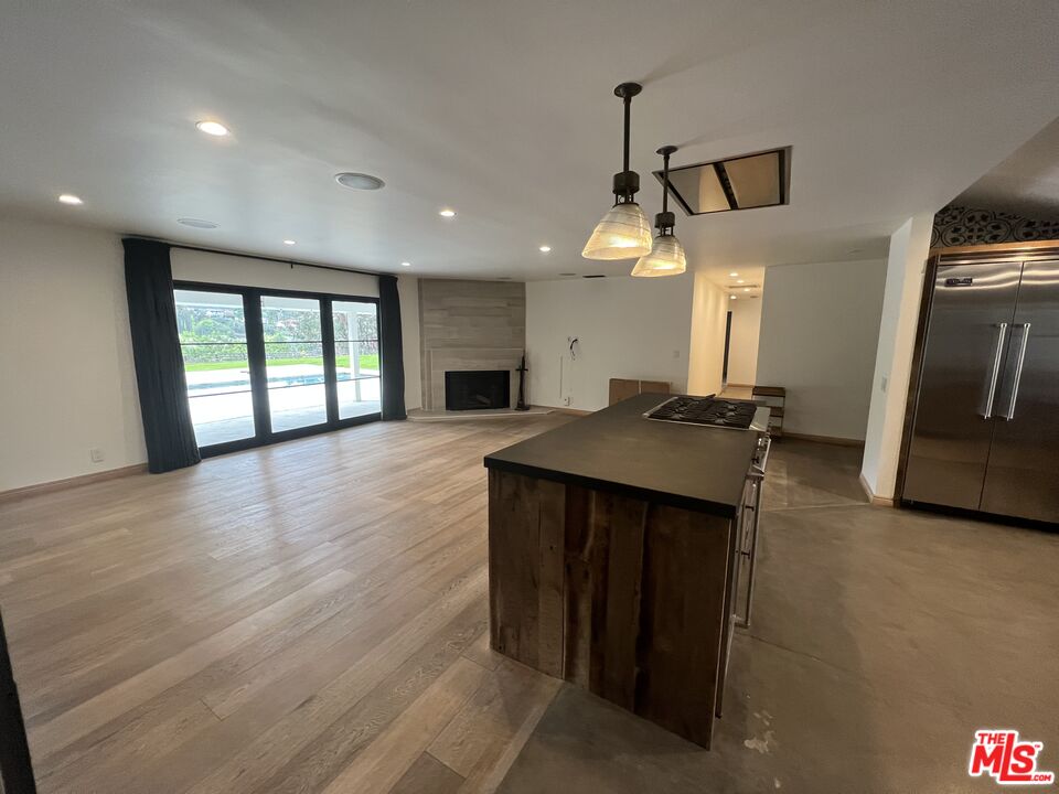 3360 Wrightview Place Studio City, CA 91604 - Photo 8 of 16 a view of a kitchen with a sink and a refrigerator