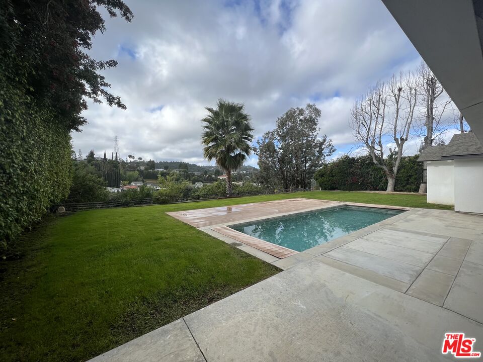 3360 Wrightview Place Studio City, CA 91604 - Photo 9 of 16 a view of a swimming pool with a yard