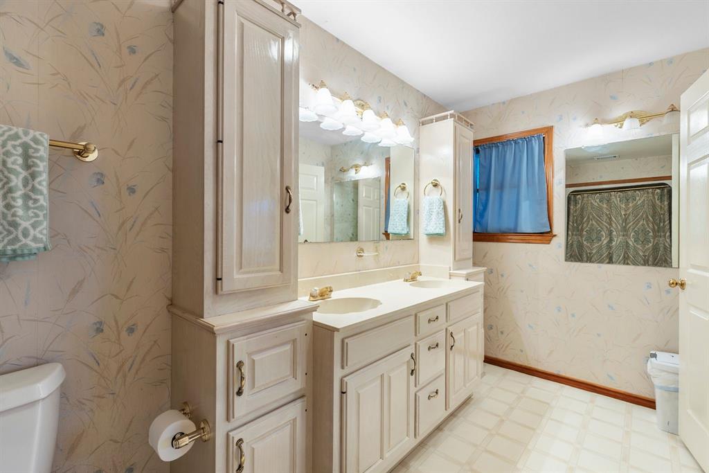476 Private Road 7326 Emory, TX 75440 - Photo 26 of 33 a bathroom with a double vanity sink toilet and shower
