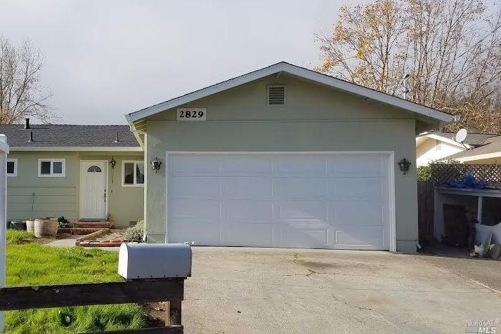 a front view of house with yard