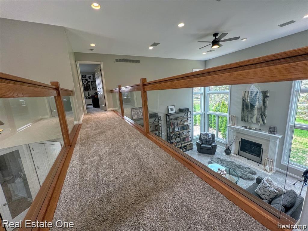 278 Oakbridge Drive Rochester, MI 48306 - Photo 46 of 75 Oak and glass bridge over foyer/great room