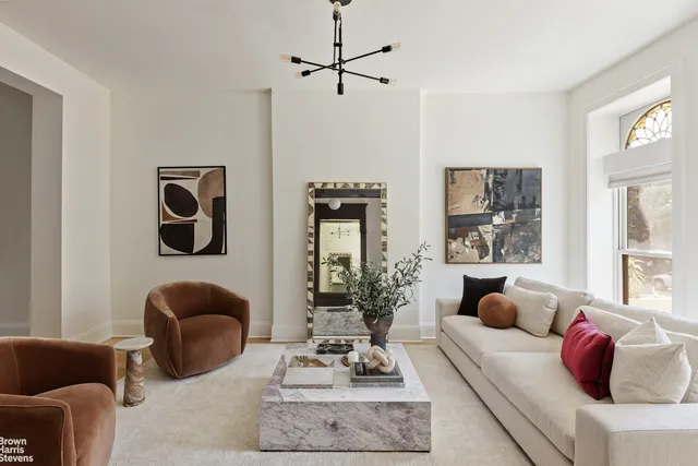 a living room with furniture or couch and a window