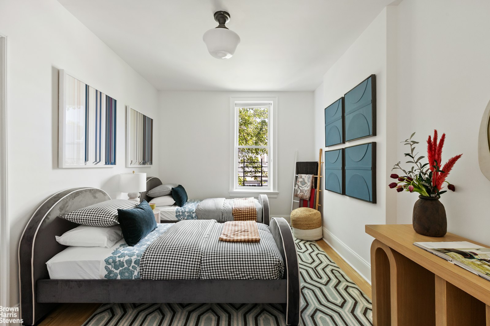 271 Decatur Street Brooklyn, NY 11233 - Photo 11 of 15 a bedroom with a bed table closet and two couches