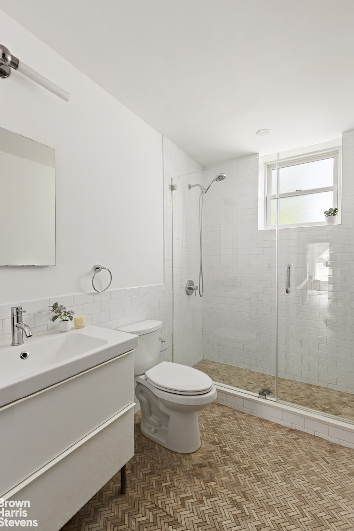 271 Decatur Street Brooklyn, NY 11233 - Photo 13 of 15 a bathroom with a sink toilet and shower