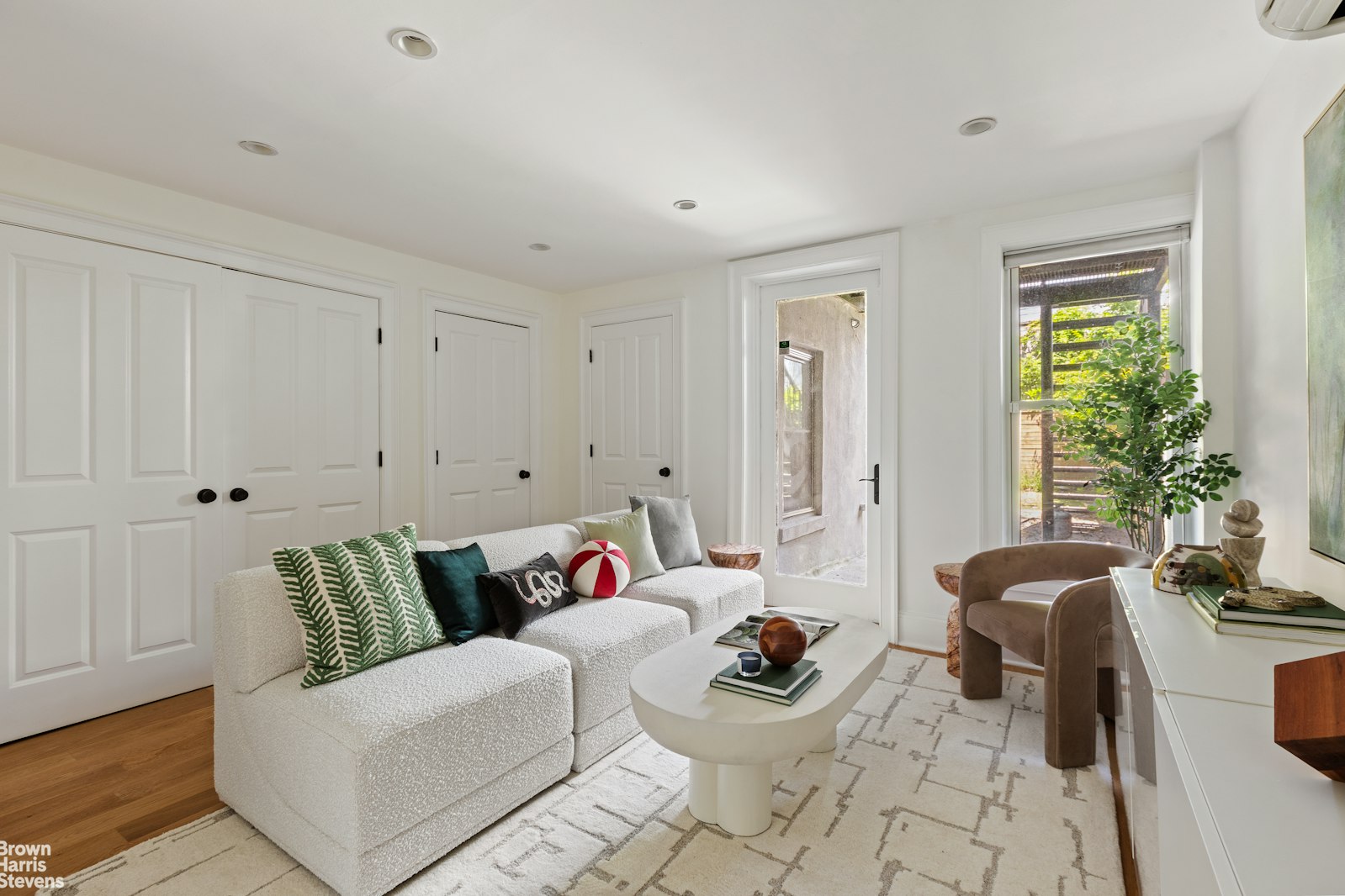 271 Decatur Street Brooklyn, NY 11233 - Photo 14 of 15 a living room with furniture and a potted plant
