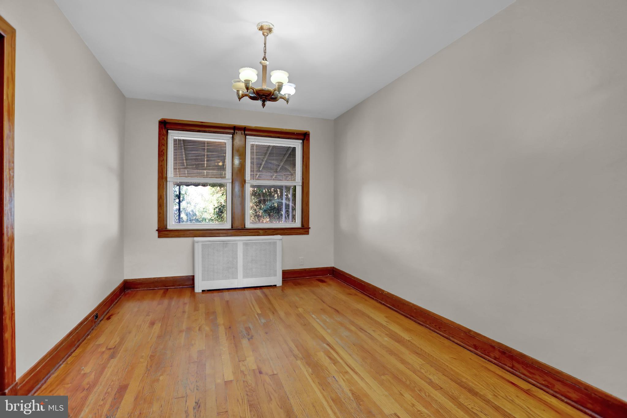 714 Rappolla Street Baltimore, MD 21224 - Photo 11 of 36 a view of empty room with wooden floor and chandelier