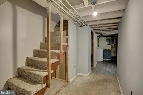 a view of livingroom with furniture and white walls