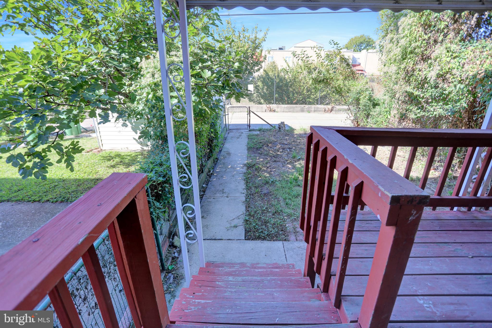 714 Rappolla Street Baltimore, MD 21224 - Photo 31 of 36 a view of balcony with wooden floor and fence