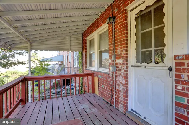 a view of a balcony with wooden floor