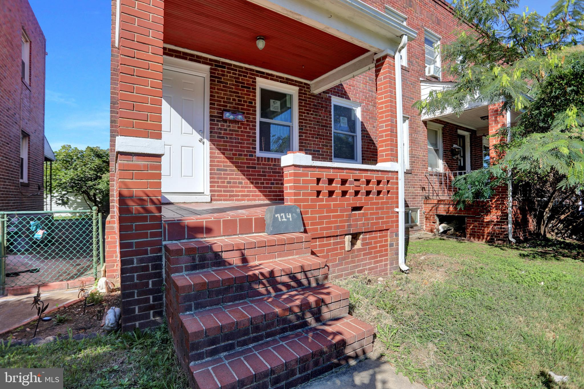 714 Rappolla Street Baltimore, MD 21224 - Photo 4 of 36 a view of a house with a yard chairs and a large tree