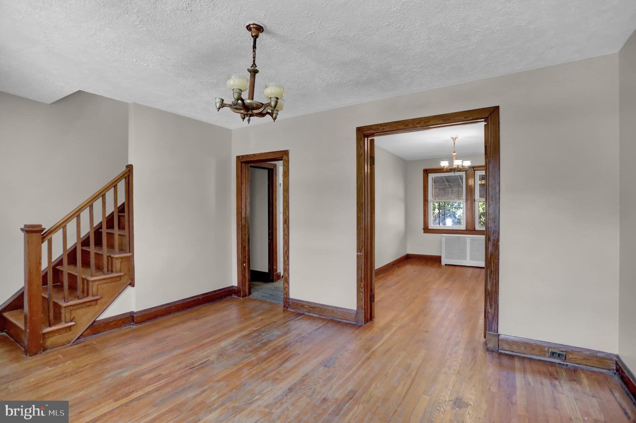 714 Rappolla Street Baltimore, MD 21224 - Photo 8 of 36 a view of a hallway with wooden floor and staircase