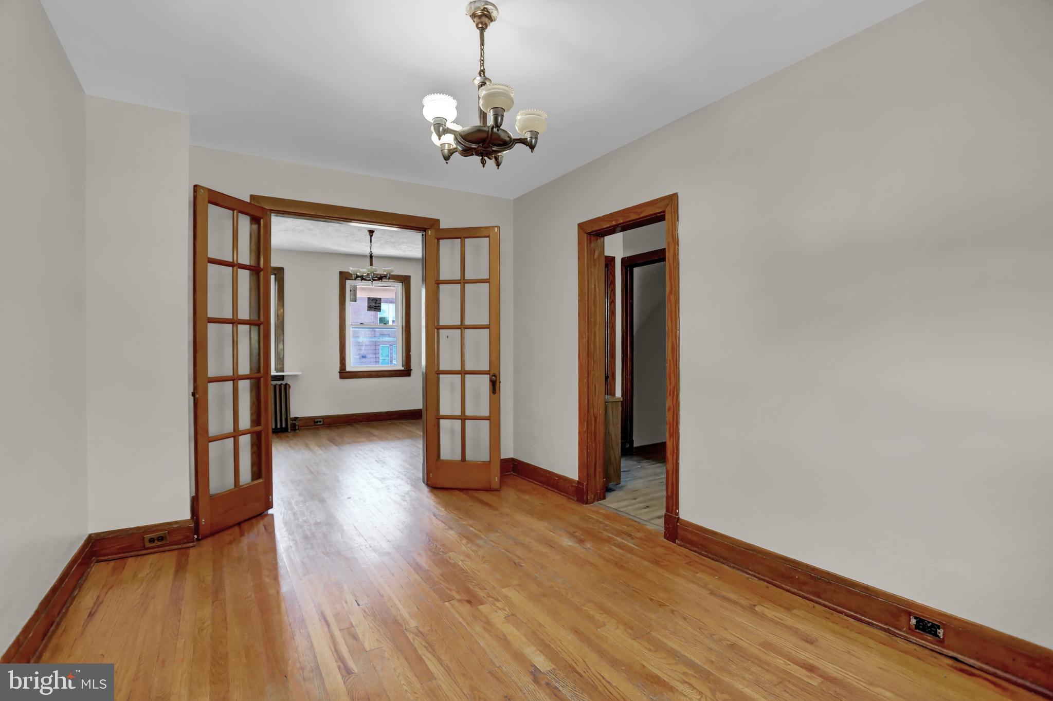 714 Rappolla Street Baltimore, MD 21224 - Photo 10 of 36 a view of livingroom with hardwood floor and window