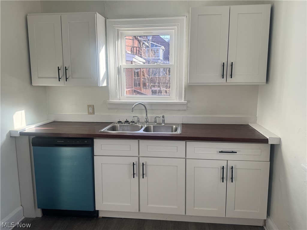 4058 Ardmore Road Cleveland, OH 44121 - Photo 7 of 14 Kitchen with white cabinetry and dishwasher
