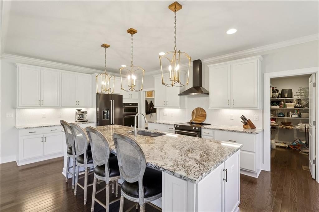 216 Hickory Lane Mars, PA 16046 - Photo 11 of 50 a kitchen with kitchen island granite countertop a stove a sink a dining table and chairs