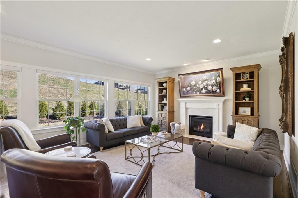 216 Hickory Lane Mars, PA 16046 - Photo 15 of 50 a living room with furniture and a fireplace